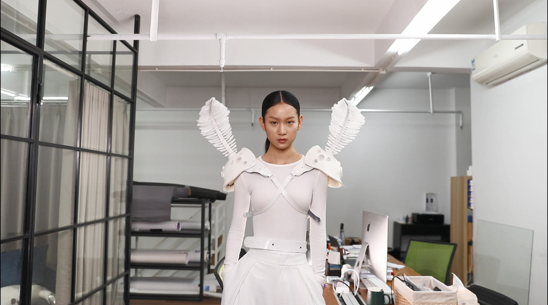 A model demonstrating the Antennae Revolution wearable in a studio.