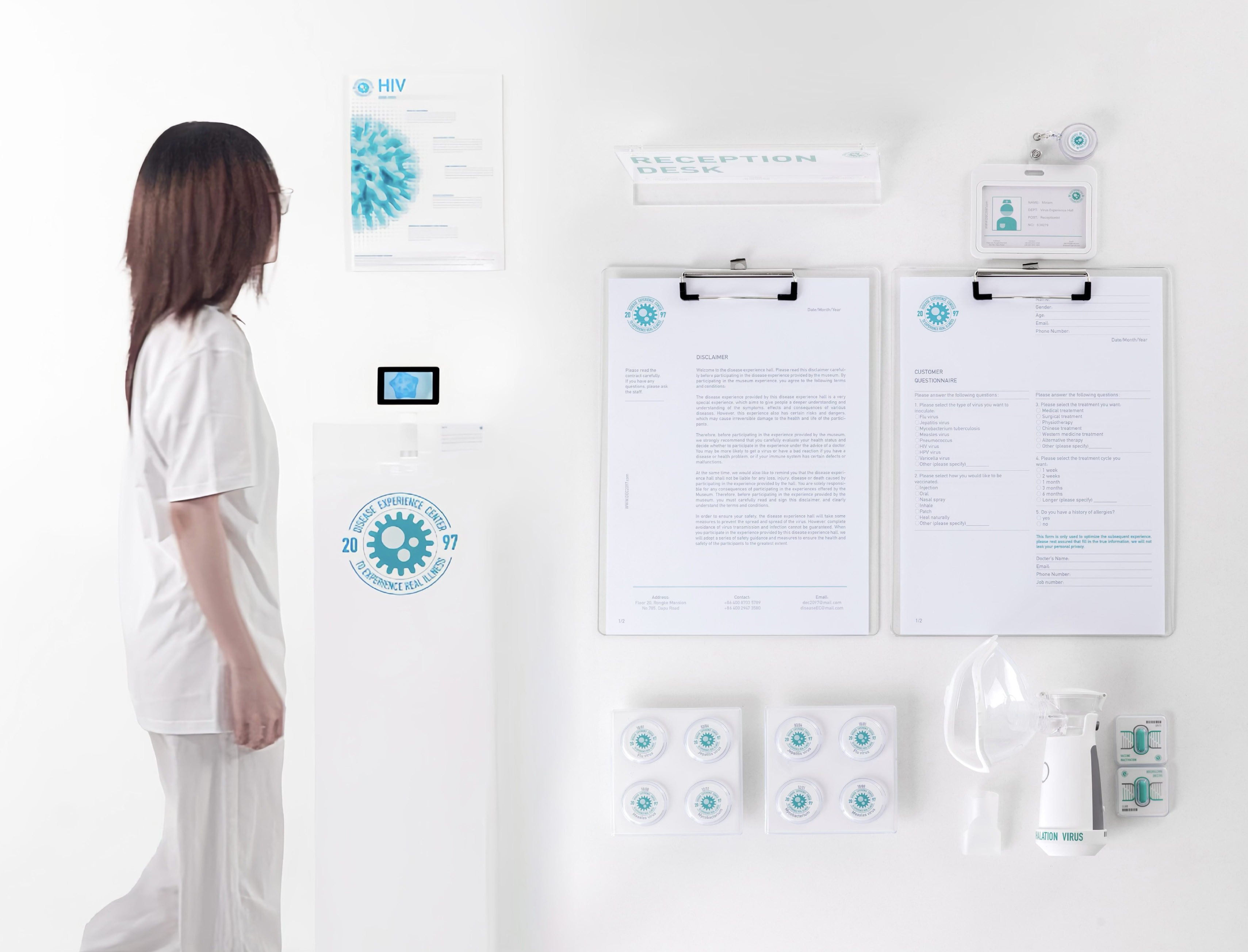 Virus Experience Hall installation with a visitor and physical learning materials.