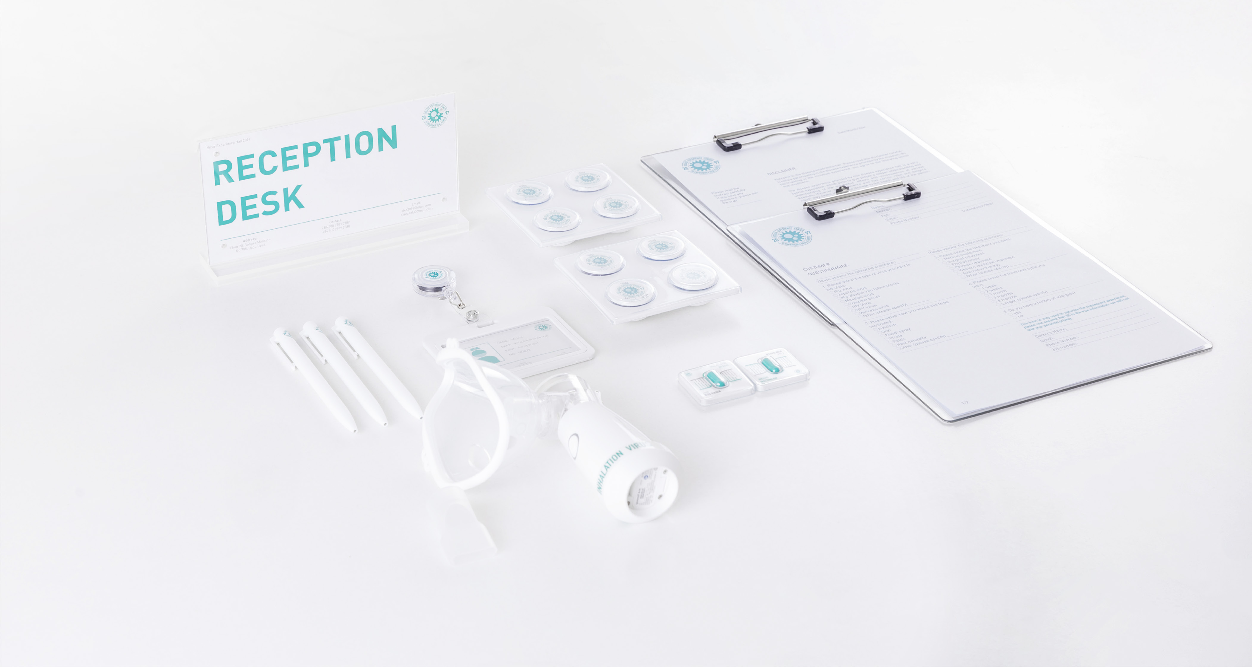 Virus Experience Hall reception materials arranged on a white surface.